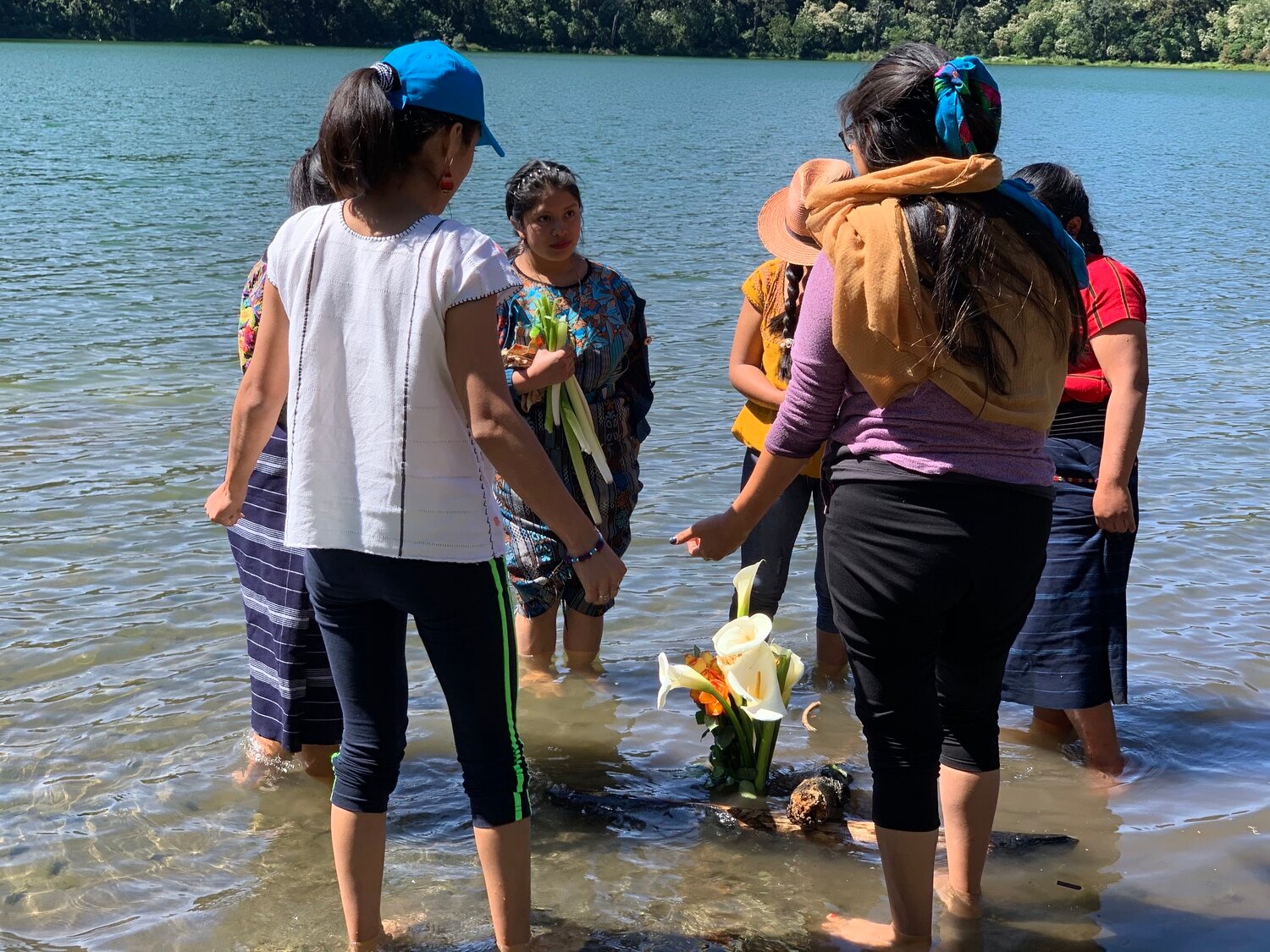  - Greeting the water at the Chikabal Lagoon, Guatemala. (Photo Credit: Nicola Wagenberg, The Cultural Conservancy)